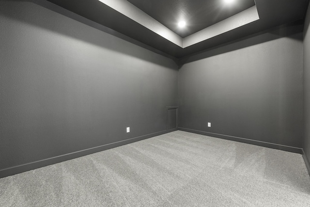 10922 Palmwood Dr, Missouri City, TX 77459 - carpeted empty room featuring a tray ceiling and baseboards