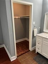 12500 Sandpiper Dr Unit 57, Houston, TX 77035 - bathroom featuring vanity and baseboards