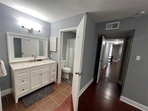 12500 Sandpiper Dr Unit 57, Houston, TX 77035 - bathroom featuring toilet and vanity