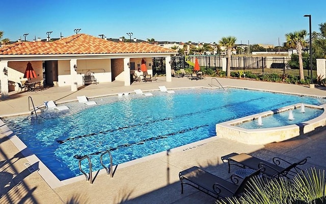 13423 Preston Cliff Ln, Houston, TX 77077 - view of swimming pool with a patio and a pool with connected hot tub