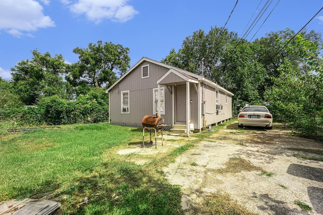 5105 Earline St, Houston, TX 77016 - view of front of house featuring driveway, a front yard, and entry steps