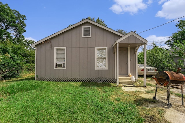 5105 Earline St, Houston, TX 77016 - bungalow-style house featuring entry steps, a front yard, and cooling unit