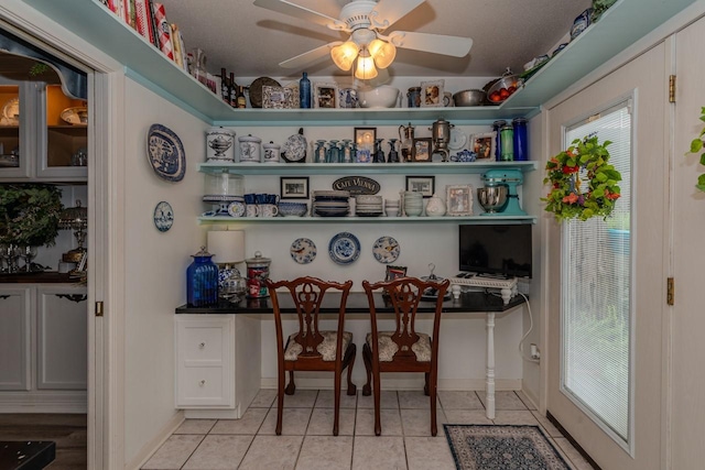 5975 Meadow Way, Beaumont, TX 77707 - office space featuring light tile patterned floors, ceiling fan, and plenty of natural light