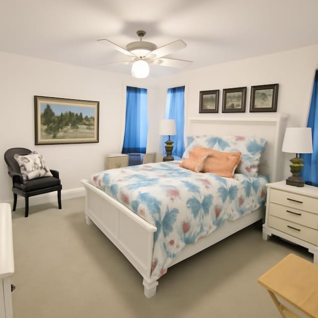 3185 Sea Castle Dr, Crystal Beach, TX 77650 - carpeted bedroom with a ceiling fan and baseboards