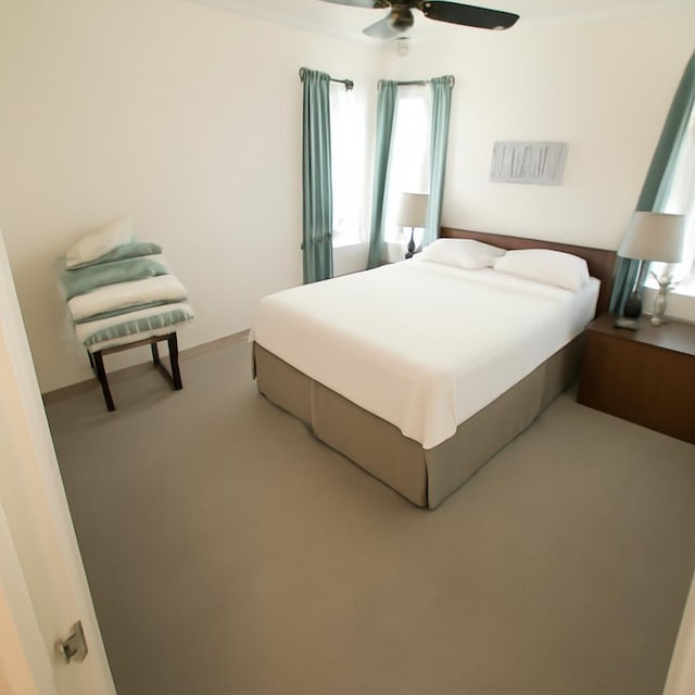 3185 Sea Castle Dr, Crystal Beach, TX 77650 - bedroom with ceiling fan