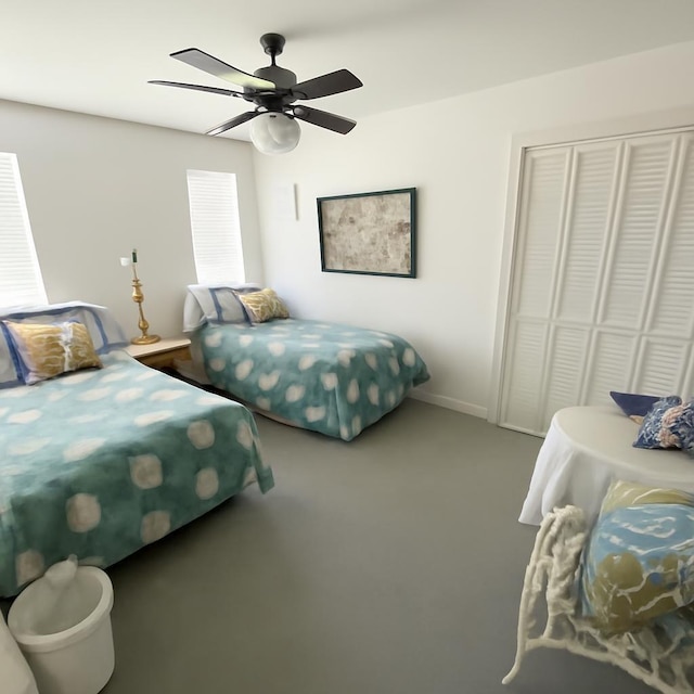 3185 Sea Castle Dr, Crystal Beach, TX 77650 - bedroom featuring a closet, ceiling fan, and carpet