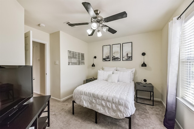 6103 Yorkglen Manor Ln, Houston, TX 77084 - bedroom featuring light colored carpet, multiple windows, and a ceiling fan