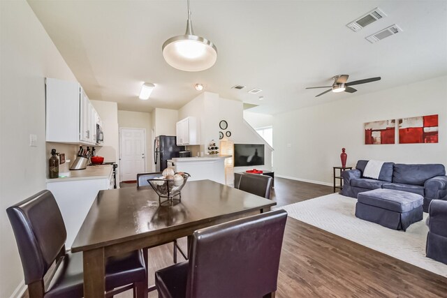 6103 Yorkglen Manor Ln, Houston, TX 77084 - dining room featuring a ceiling fan and dark wood-style flooring