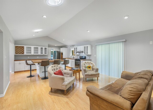 420 Hale St, Lexington, TX 78947 - living area featuring light wood-style flooring and vaulted ceiling