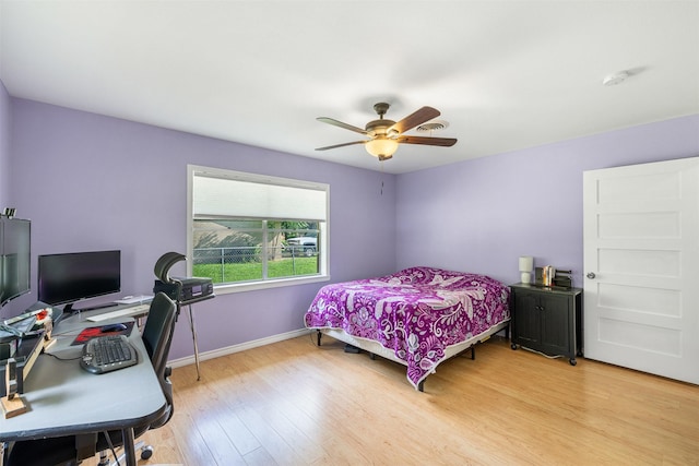 420 Hale St, Lexington, TX 78947 - bedroom featuring light wood finished floors, ceiling fan, and an office area