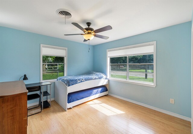 420 Hale St, Lexington, TX 78947 - bedroom featuring wood finished floors and a ceiling fan