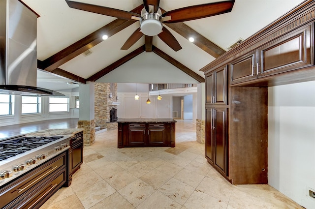 6803 Fawncliff Dr, Houston, TX 77069 - kitchen with wall chimney range hood, ceiling fan, dark brown cabinets, and stainless steel gas stovetop