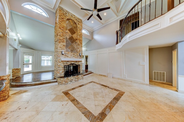 6803 Fawncliff Dr, Houston, TX 77069 - unfurnished living room featuring a decorative wall, a fireplace, coffered ceiling, a ceiling fan, and beamed ceiling