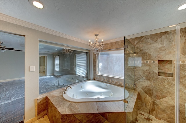 6803 Fawncliff Dr, Houston, TX 77069 - bathroom with a chandelier, a tub with jets, ornamental molding, tiled shower, and a textured ceiling