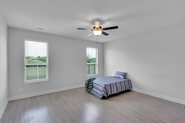 1708 Stillwater Dr, Burleson, TX 76028 - bedroom featuring light wood-style flooring and ceiling fan