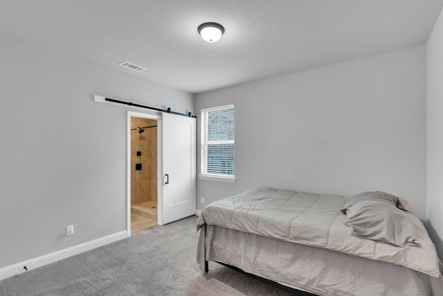 1708 Stillwater Dr, Burleson, TX 76028 - bedroom featuring a barn door, carpet flooring, and ensuite bathroom