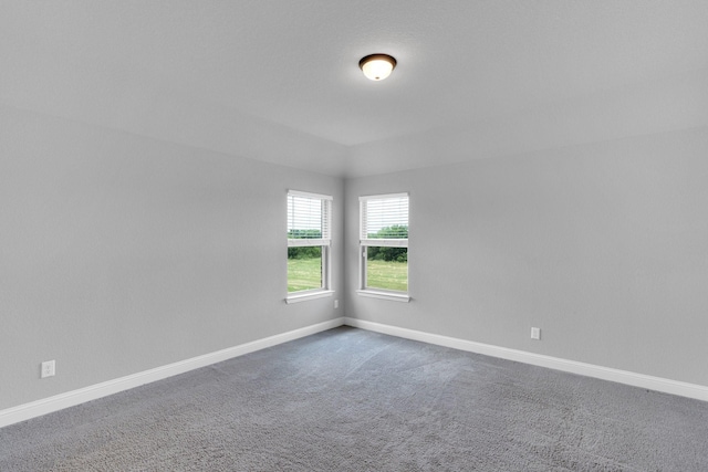 1708 Stillwater Dr, Burleson, TX 76028 - empty room with dark colored carpet and baseboards