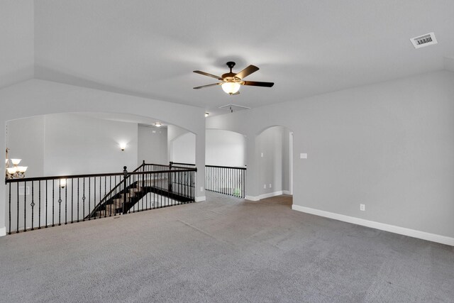 1708 Stillwater Dr, Burleson, TX 76028 - spare room with ceiling fan, carpet floors, and arched walkways