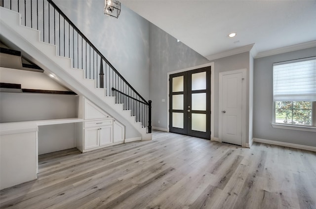 13619 Teal Bluff Ln, Houston, TX 77077 - entryway featuring french doors, stairway, light wood-type flooring, ornamental molding, and recessed lighting