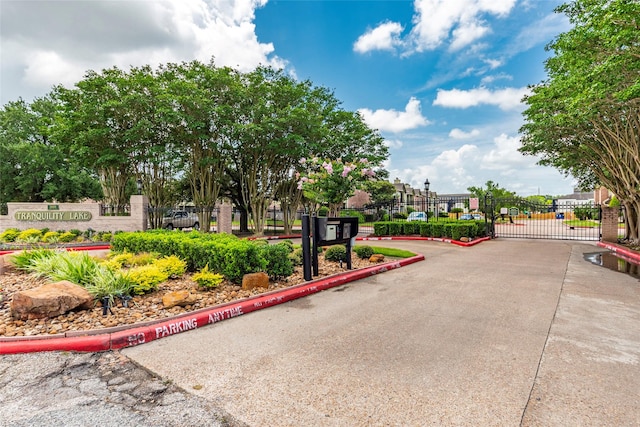 18800 Egret Bay Blvd Unit 1405, Webster, TX 77058 - view of concrete road with curbs, a gate, and a gated entry