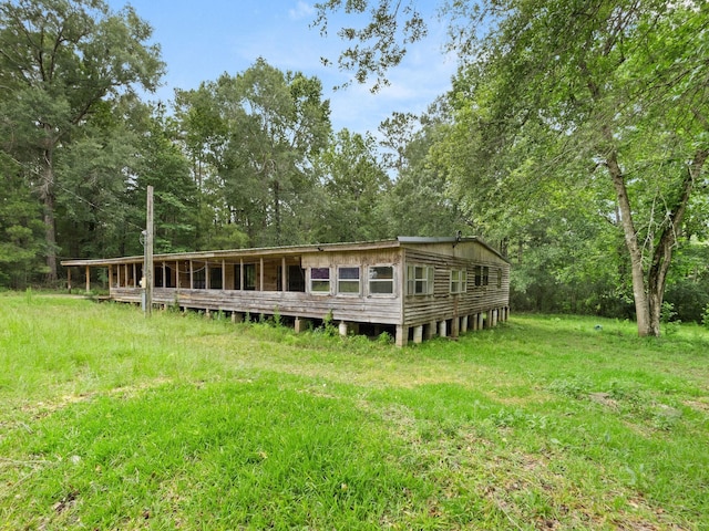 19995 Fm 92 S, Fred, TX 77616 - back of house featuring view of wooded area