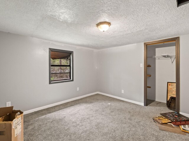 19995 Fm 92 S, Fred, TX 77616 - unfurnished bedroom with carpet flooring and a textured ceiling