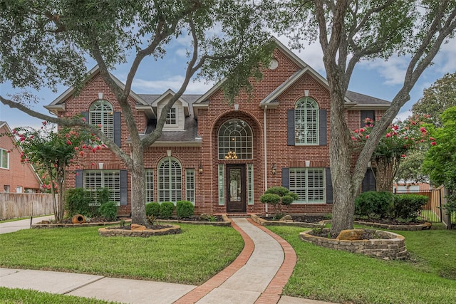 9 Foxworth Ct, Sugar Land, TX 77479 - view of front of home featuring brick siding and a shingled roof