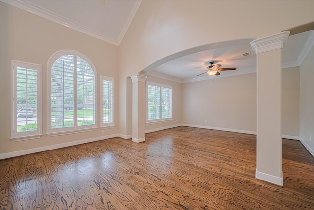 9 Foxworth Ct, Sugar Land, TX 77479 - unfurnished living room featuring crown molding, a ceiling fan, decorative columns, wood finished floors, and arched walkways