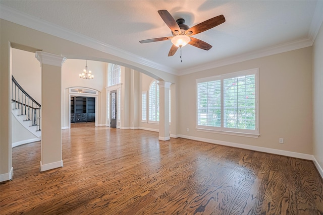 9 Foxworth Ct, Sugar Land, TX 77479 - unfurnished living room featuring decorative columns, ornamental molding, wood finished floors, and healthy amount of natural light