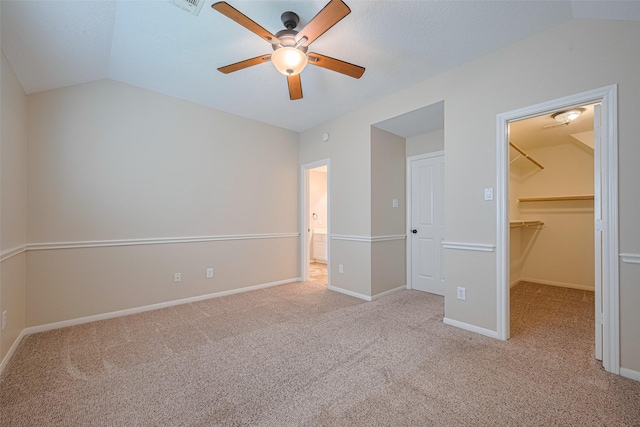 9 Foxworth Ct, Sugar Land, TX 77479 - unfurnished bedroom with lofted ceiling, a spacious closet, carpet floors, and ceiling fan