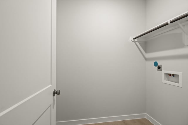 7826 Ruthie Ravine Ct, Spring, TX 77379 - laundry area with electric dryer hookup, washer hookup, and wood finished floors