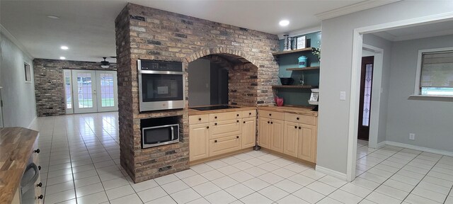 413 S Temple Dr, Diboll, TX 75941 - kitchen with appliances with stainless steel finishes, light tile patterned floors, healthy amount of natural light, crown molding, and recessed lighting