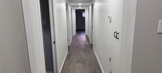 413 S Temple Dr, Diboll, TX 75941 - hallway with wood finished floors, a textured wall, and recessed lighting