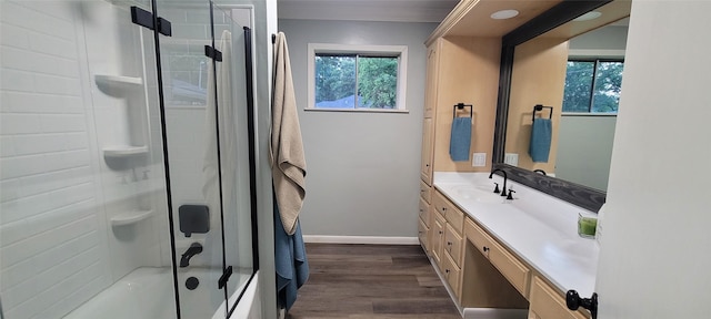 413 S Temple Dr, Diboll, TX 75941 - bathroom featuring vanity, wood finished floors, and bath / shower combo with glass door