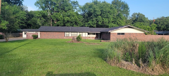413 S Temple Dr, Diboll, TX 75941 - ranch-style home featuring brick siding, concrete driveway, and an attached garage