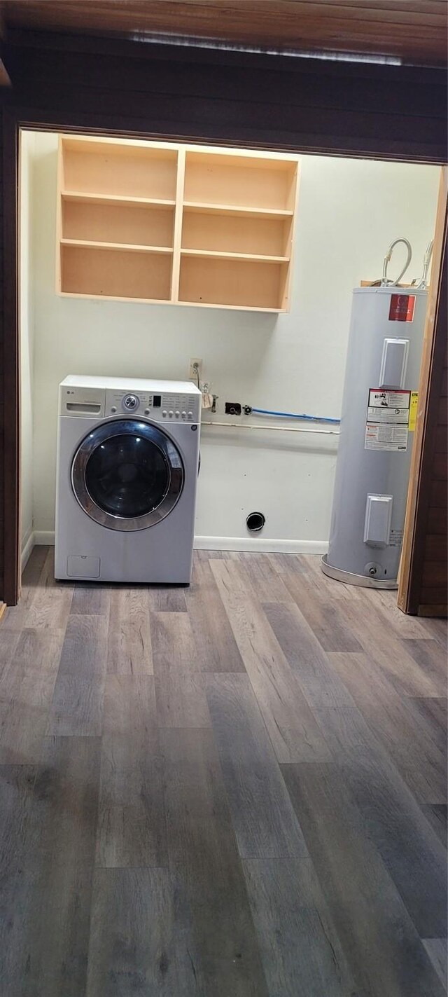 413 S Temple Dr, Diboll, TX 75941 - laundry room with washer / clothes dryer, electric water heater, and wood finished floors