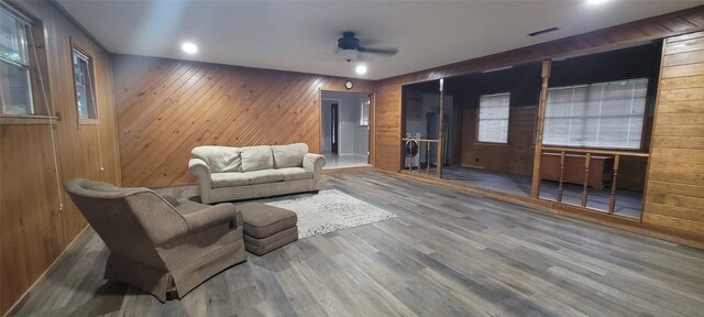 413 S Temple Dr, Diboll, TX 75941 - living room with ceiling fan, wood finished floors, and wood walls