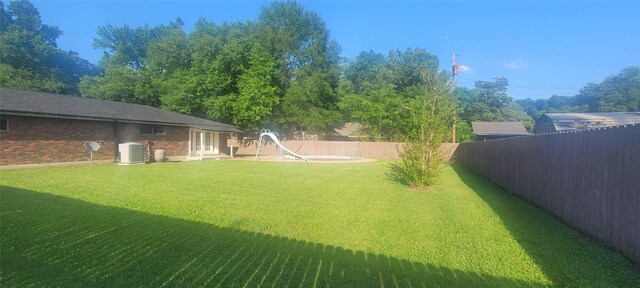 413 S Temple Dr, Diboll, TX 75941 - fenced backyard featuring french doors
