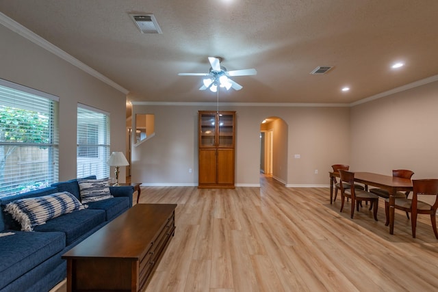 5242 Garnetfield Ln, Katy, TX 77494 - living area featuring arched walkways, light wood-type flooring, ceiling fan, crown molding, and recessed lighting