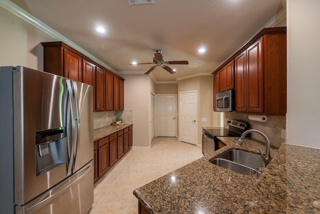 5242 Garnetfield Ln, Katy, TX 77494 - kitchen with stainless steel appliances, ceiling fan, ornamental molding, backsplash, and recessed lighting