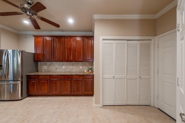 5242 Garnetfield Ln, Katy, TX 77494 - kitchen with stainless steel fridge with ice dispenser, crown molding, ceiling fan, tasteful backsplash, and light stone countertops