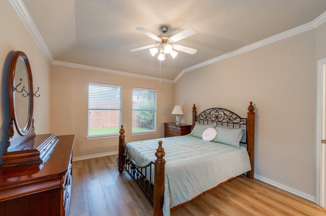 5242 Garnetfield Ln, Katy, TX 77494 - bedroom featuring light wood-style flooring, crown molding, and ceiling fan