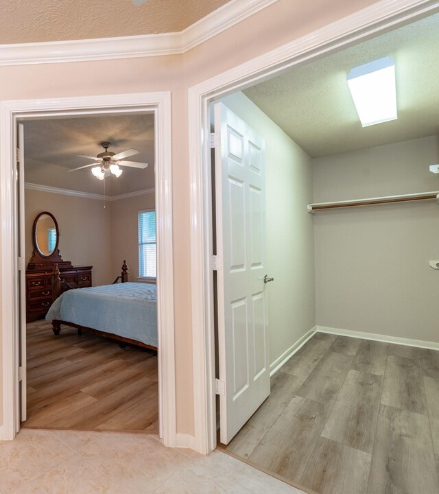 5242 Garnetfield Ln, Katy, TX 77494 - hall featuring ornamental molding and wood finished floors