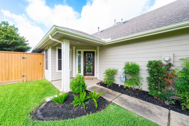 5242 Garnetfield Ln, Katy, TX 77494 - property entrance with a lawn and roof with shingles