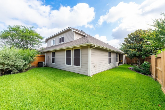 5242 Garnetfield Ln, Katy, TX 77494 - back of house with a fenced backyard and roof with shingles