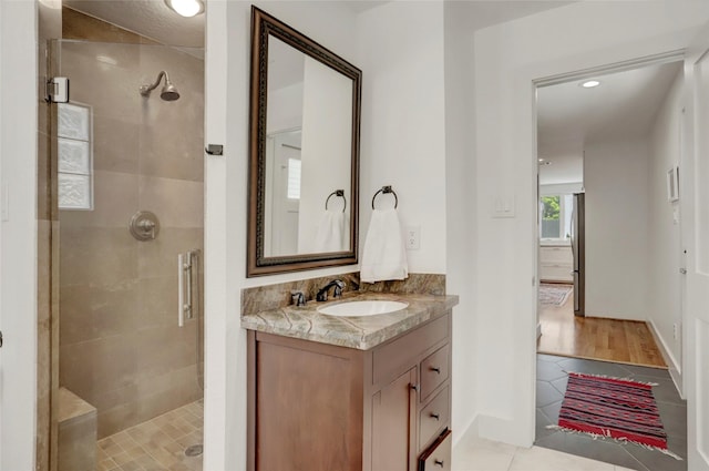1039 Lamonte Ln, Houston, TX 77018 - full bath with a stall shower, vanity, tile patterned flooring, and recessed lighting