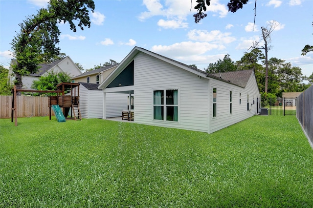 1039 Lamonte Ln, Houston, TX 77018 - back of house featuring a playground, a fenced backyard, and roof with shingles