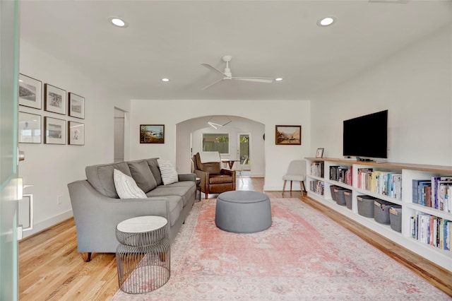 1039 Lamonte Ln, Houston, TX 77018 - living room with arched walkways, light wood-style floors, a ceiling fan, and recessed lighting