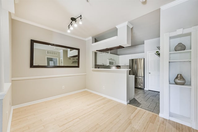 1330 Old Spanish Trl Unit 1210, Houston, TX 77054 - unfurnished room featuring light wood-style floors, ornamental molding, and rail lighting