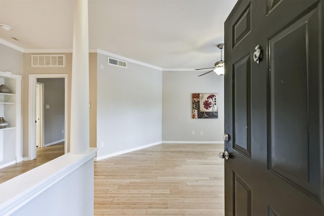 1330 Old Spanish Trl Unit 1210, Houston, TX 77054 - foyer entrance with crown molding, ceiling fan, and light wood-style floors